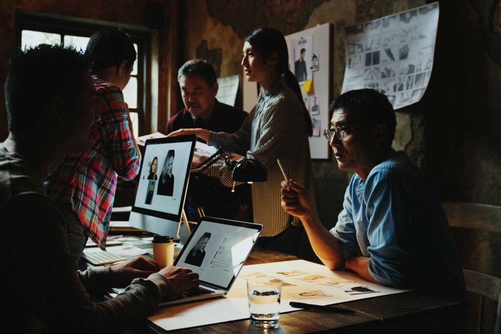 group of creative people working and brainstorming F9J86RY